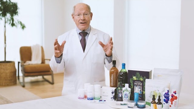 Dr. Ray Strand with Tahitian Noni products